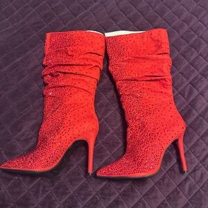 Beautiful Red suede and red rhinestones calf length boots!
11/43
Color Red